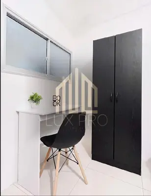 a black chair sitting at a desk in a room at Residensi prima kampung paloh in Ipoh