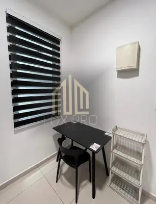 a black table and chair in a room with a window at Residensi prima kampung paloh in Ipoh