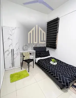 a bedroom with a bed and a desk at Residensi prima kampung paloh in Ipoh