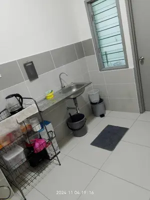 a bathroom with a sink and a toilet and a sink at Prima Resident Meru Ipoh in Ipoh