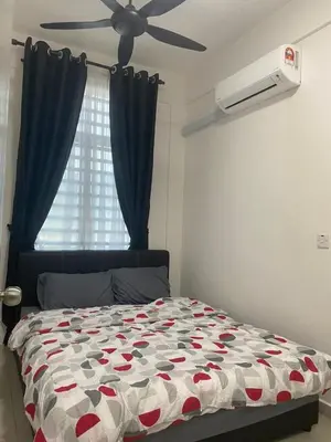 a bedroom with a bed and a ceiling fan at Prima Resident Meru Ipoh in Ipoh