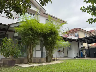 a house with trees in the front yard at Hi-Tea HomeStay in Sungai Petani
