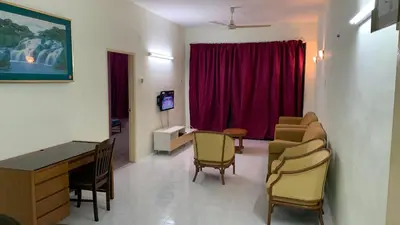 a hospital room with a table and chairs at Homestay Bintang Maya in Sungai Petani
