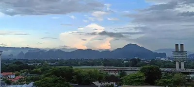 a view of a city with mountains in the background at Japan Comfort Lifestyle Hokkaido in Ipoh