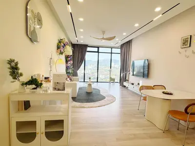 a living room with a couch and a table at The Floral Retreat N3w Cozy High floor Beacon Executive Suite in George Town