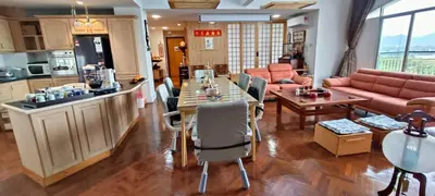 a kitchen and living room with a table and chairs at Japan Comfort Lifestyle Nagoya in Ipoh