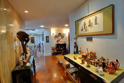 a living room filled with lots of figurines on a table at Japan Comfort Lifestyle Nagoya in Ipoh
