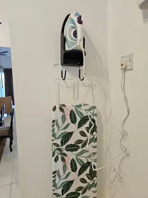a camera hanging on a wall next to a wall at Ipoh Meru Landed Homestay TropiCasa 28 in Ipoh