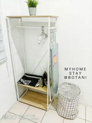 a small bathroom with a shelf and a sink at MyHomestay Botani in Ipoh