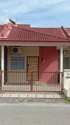 a red house with a red roof and a gate at MyHomestay Botani in Ipoh