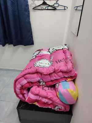 a bed sitting on a shelf in a room at Suria Permai19 Homestay in Taiping