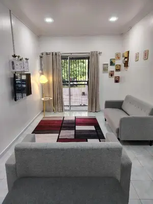a living room with a couch and a table at Suria Permai19 Homestay in Taiping