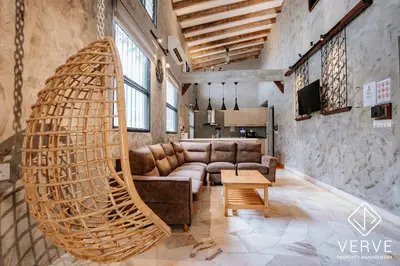 a living room with a couch and a large swing at R Private Club House 4B4B 16 pax by Verve in Ipoh