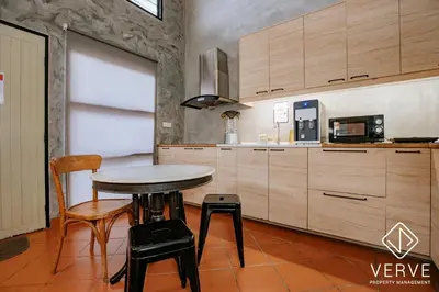 a kitchen with a table and chairs in a room at R Private Club House 4B4B 16 pax by Verve in Ipoh