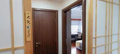 a hallway with a door and a room with a table at Japan Comfort Lifestyle Osaka in Ipoh
