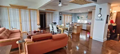a living room with couches and a dining room at Japan Comfort Lifestyle Osaka in Ipoh