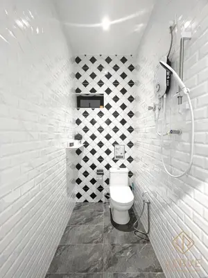 a white bathroom with a shower and a toilet at Ipoh C Private Club House by Verve EECH109 in Ipoh