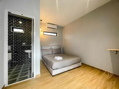a small bedroom with a bed and a bathroom at Ipoh C Private Club House by Verve EECH109 in Ipoh