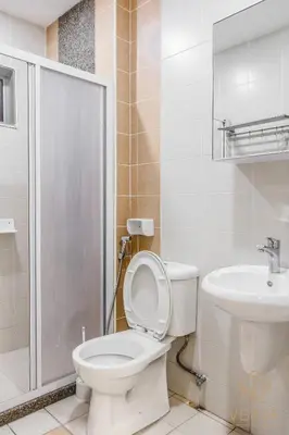 a bathroom with a toilet and a sink at Ipoh Lang Villa Premium Semi-D Villa by Verve in Ipoh
