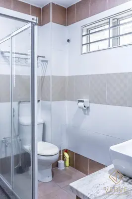 a bathroom with a toilet and a glass shower at Ipoh Lang Villa Premium Semi-D Villa by Verve in Ipoh