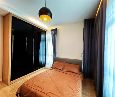 a bedroom with a bed and a large window at Luxury 5BR stay walk to beach & Night market fun in Batu Ferringhi