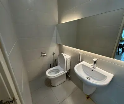 a bathroom with a toilet and a sink at Large Family Villa Beach & Night Market Steps Away 20 Pax in Batu Ferringhi