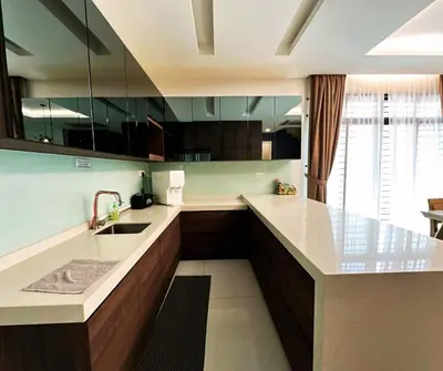 a kitchen with a sink and a counter top at Large Family Villa Beach & Night Market Steps Away 20 Pax in Batu Ferringhi