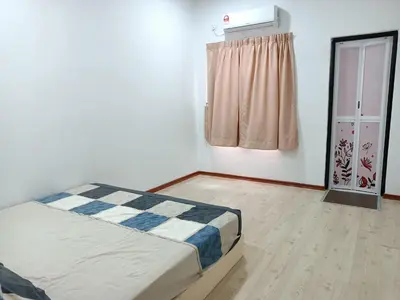a small bedroom with a bed and a window at 28 Home in Pusing