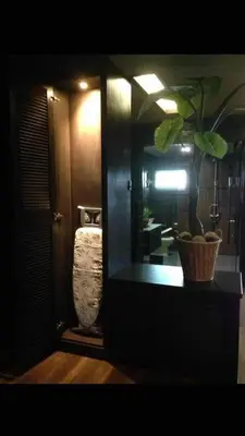 a bathroom with a mirror and a plant on a counter at 30A Studio Room Medan Ipoh with Pool Table in Ipoh