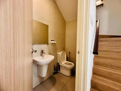 a small bathroom with a toilet and a sink at Exclusive Luxury 2MIN Walk to Beach & Night Market in Batu Ferringhi