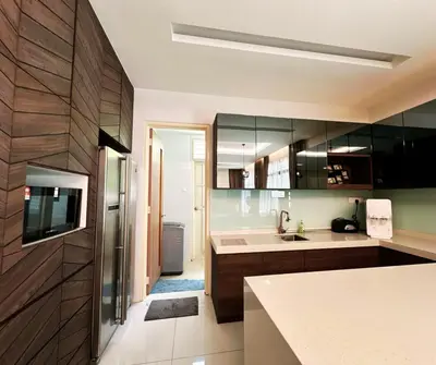 a kitchen with a sink and a refrigerator at Exclusive Luxury 2MIN Walk to Beach & Night Market in Batu Ferringhi