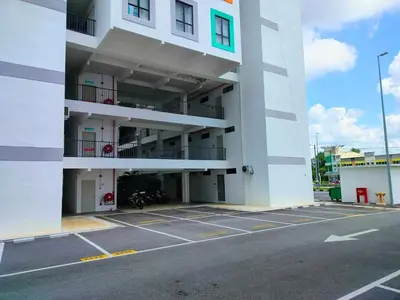 a large white building with a parking lot at IFS SoHo 2 Basic Studio in Seri Iskandar