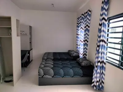 a bedroom with a bed in a room at IFS SoHo 2 Basic Studio in Seri Iskandar