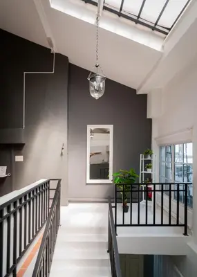 a staircase in a building with a glass ceiling at Aayu Church St - 7 mins to Esplanade, George Town in George Town