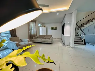a living room with two couches and a staircase at Shamrock Bay Haven 5BR Homestay for 22pax at B Ferringghi in Batu Ferringhi