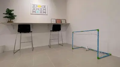 a room with a soccer ball and two stools at BM IconCity Landed Home by Wemestay - Near AutoCity, Juru, Penang Bridge in Bukit Mertajam