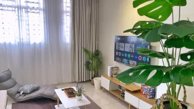 a living room with a couch and a tv at BM IconCity Landed Home by Wemestay - Near AutoCity, Juru, Penang Bridge in Bukit Mertajam
