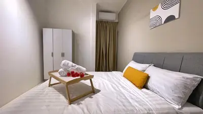 a bedroom with a bed with a table on it at BM IconCity Landed Home by Wemestay - Near AutoCity, Juru, Penang Bridge in Bukit Mertajam