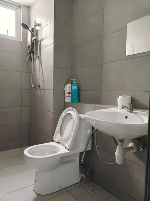a bathroom with a toilet and a sink at Metropol Serviced Apartment - Bukit Mertajam, Penang in Bukit Mertajam