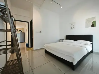 a white bedroom with a bed and a ladder at Metropol Serviced Apartment - Bukit Mertajam, Penang in Bukit Mertajam