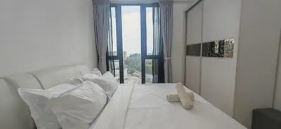 a white bed in a room with a window at Island Jazz Loft with Bathtub & Seaview - Jazz Suites by Ocean Luxe in Tanjong Tokong