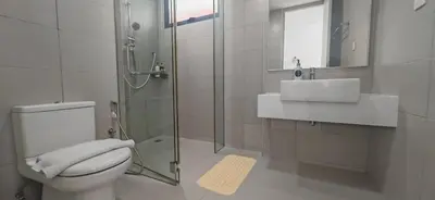 a bathroom with a toilet and a sink and a shower at Island Jazz Loft with Bathtub & Seaview - Jazz Suites by Ocean Luxe in Tanjong Tokong