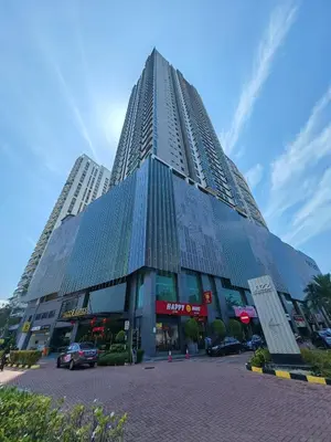 a tall building with cars parked in front of it at Island Jazz Loft with Bathtub & Seaview - Jazz Suites by Ocean Luxe in Tanjong Tokong