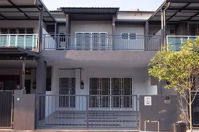 a white house with a balcony on top of it at Taiping Bali Home 5R3B, 7mins-Tpg Lake Gardens in Taiping