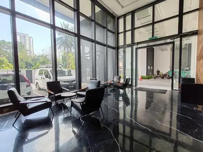 a large room with chairs and tables and windows at Urban Suites, 2 Rooms, 5 Pax, Free Car Park in Jelutong