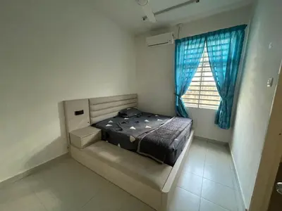 a bedroom with a bed with blue curtains and a window at MDRS Seroja 7 in Kuala Ketil