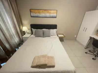 a bedroom with a bed with a towel on it at Ipoh The Anderson 5pax Suite #82 in Ipoh