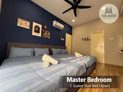 a bedroom with a large bed with towels on it at Verdant Sunset The Cove Ipoh in Ipoh