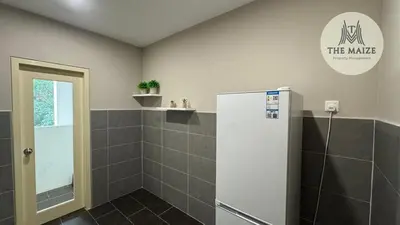 a bathroom with a walk in shower and a toilet at Verdant Sunset The Cove Ipoh in Ipoh