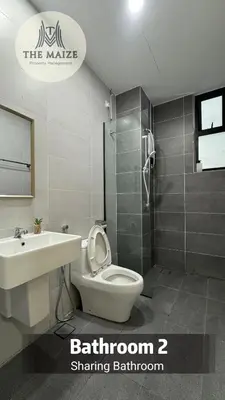 a bathroom with a toilet and a sink and a shower at Verdant Sunset The Cove Ipoh in Ipoh